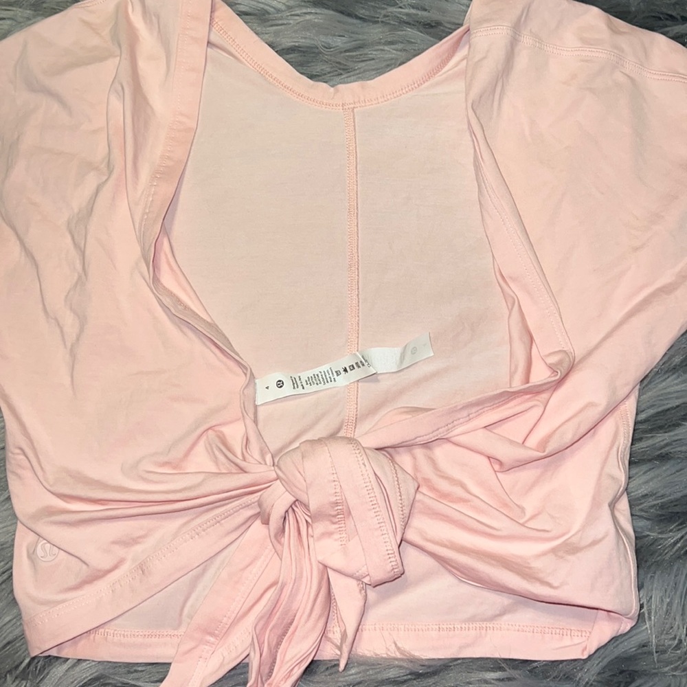 Pink open back wrap Lululemon top. Size 4.